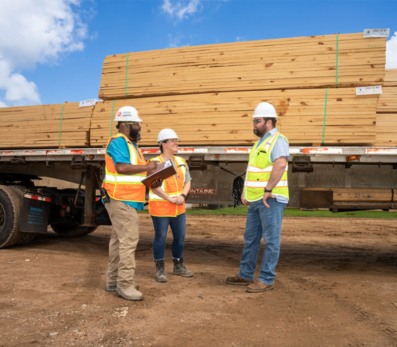 Employees Meeting near leaded trailer